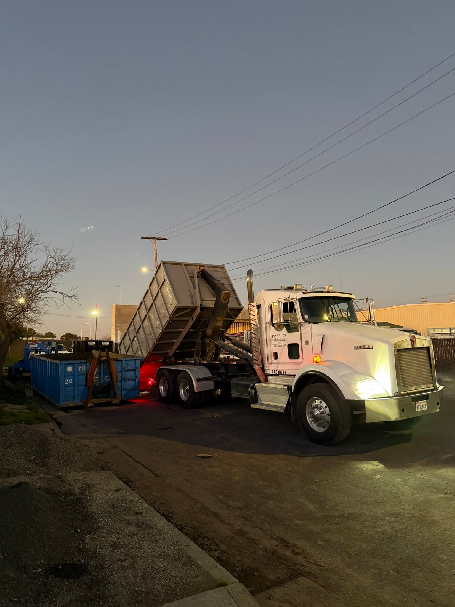 Corona Junk Removal dump truck at work